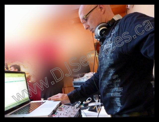 DJ StereoMike performing live behind the DJ booth