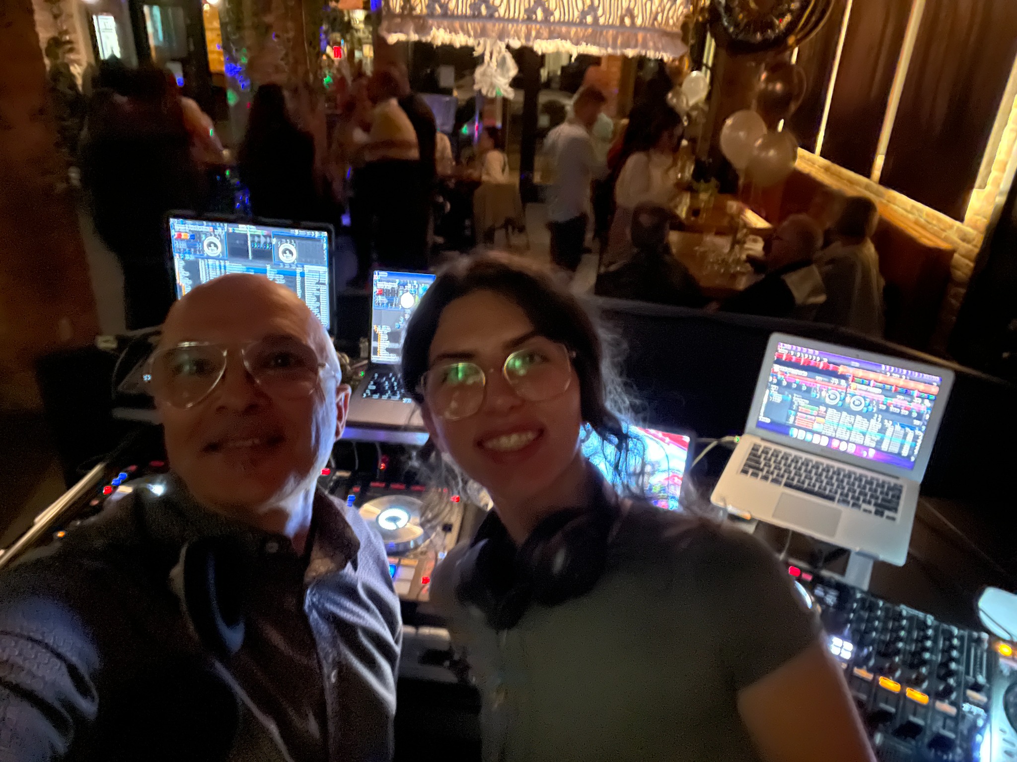 DJ StereoMike beside the DJ booth during a live event