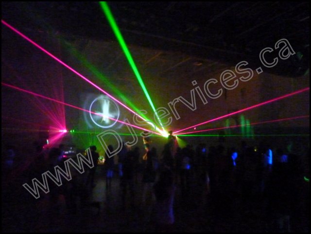 Colourful laser and moving-light effects over a dance floor